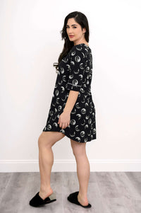 Back and side view of woman in a moon phase bamboo sleepshirt with piping details