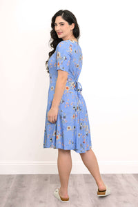Back and side view of a blue floral dress with tie belt detailing