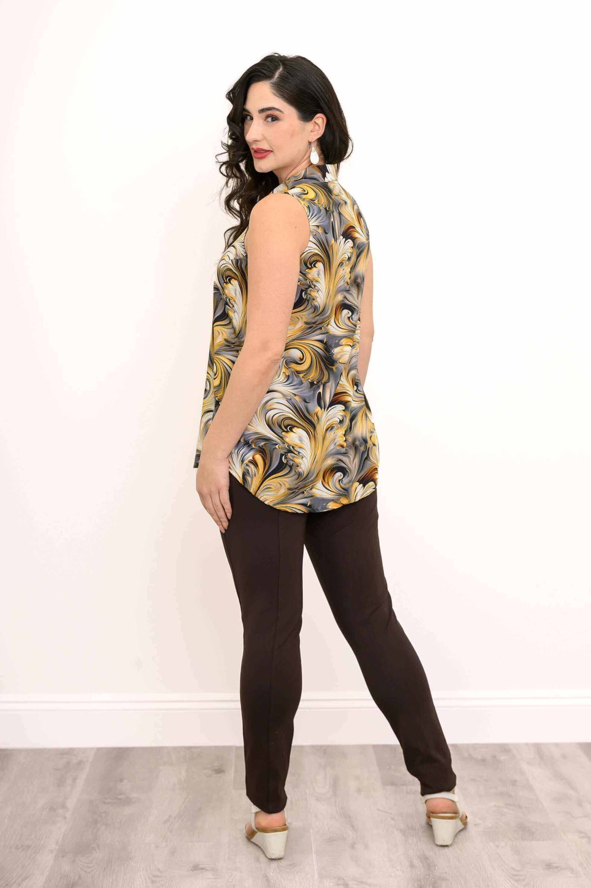 Model showing back and side of sleeveless golden marble tank top, looking back