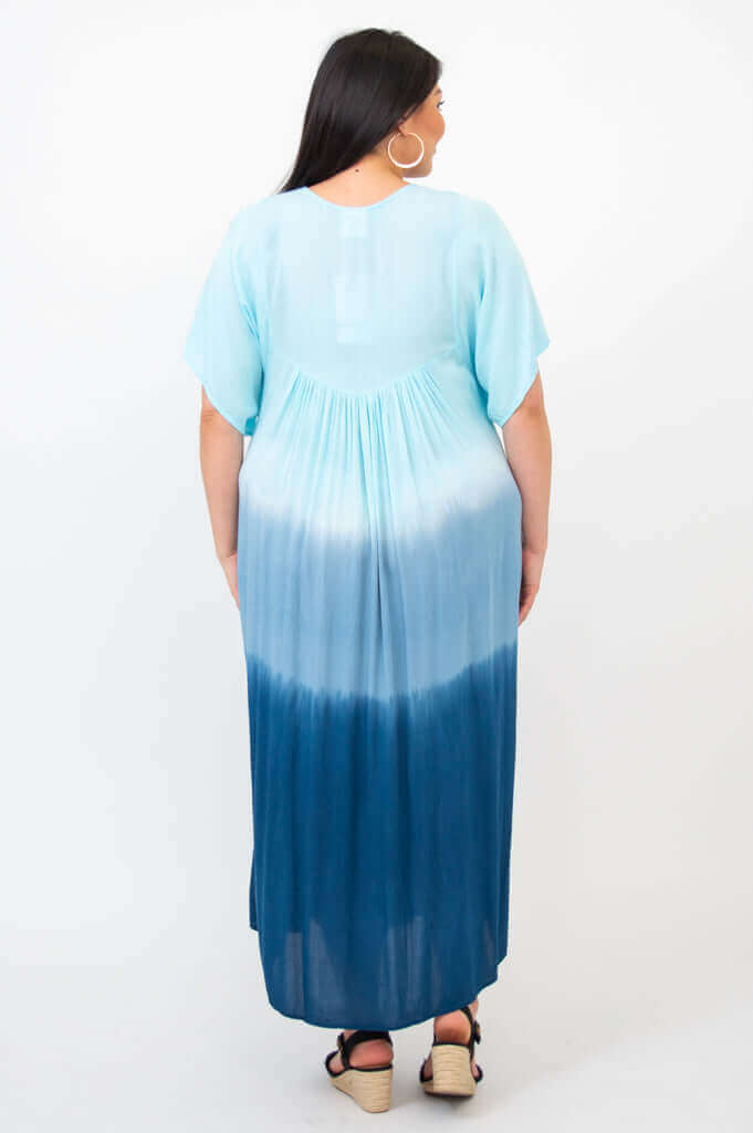 Back view of woman wearing blue ombre tiered maxi dress