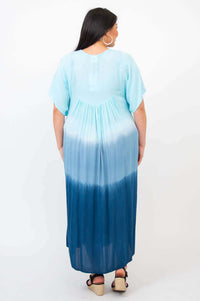 Back view of woman wearing blue ombre tiered maxi dress