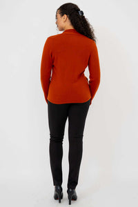 Back view of model wearing rust sweater