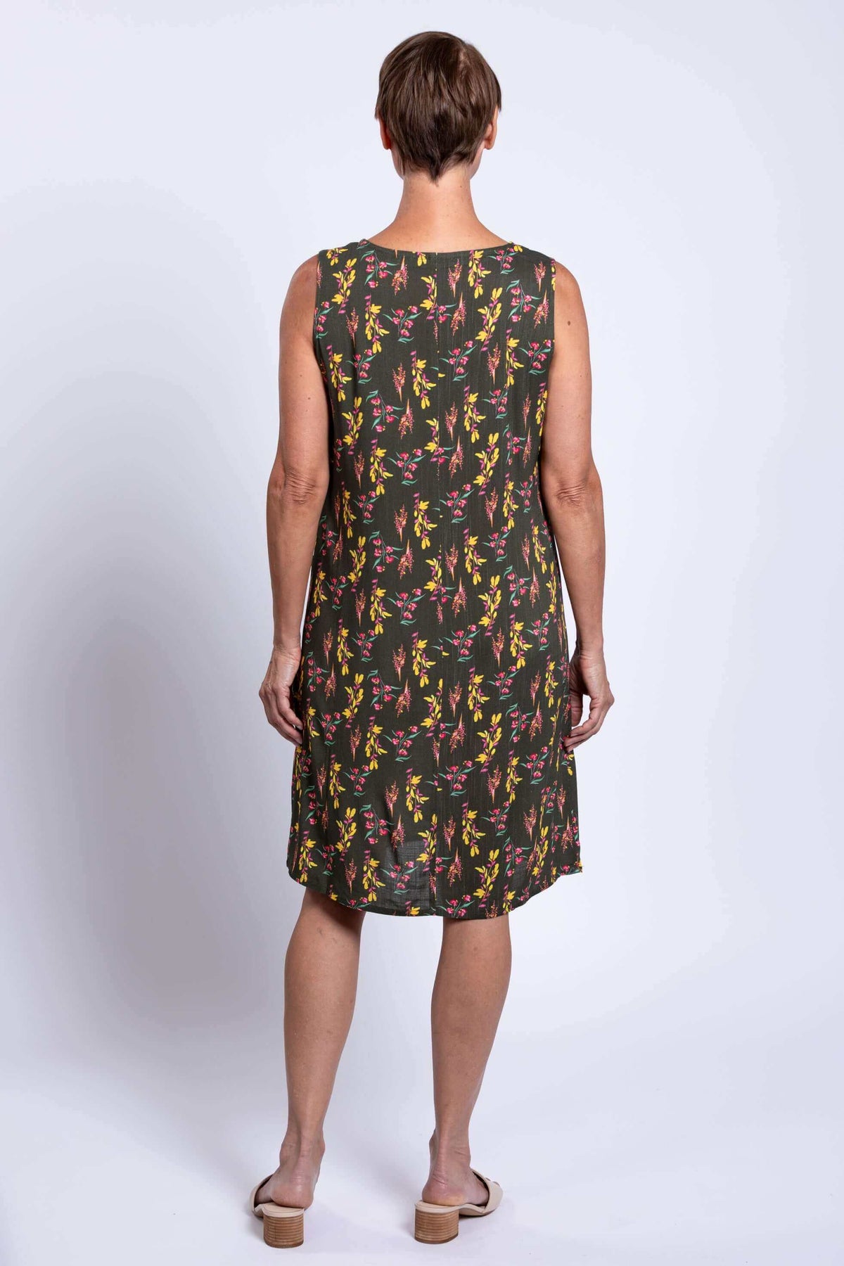 Back view of woman wearing floral Felicia shift dress