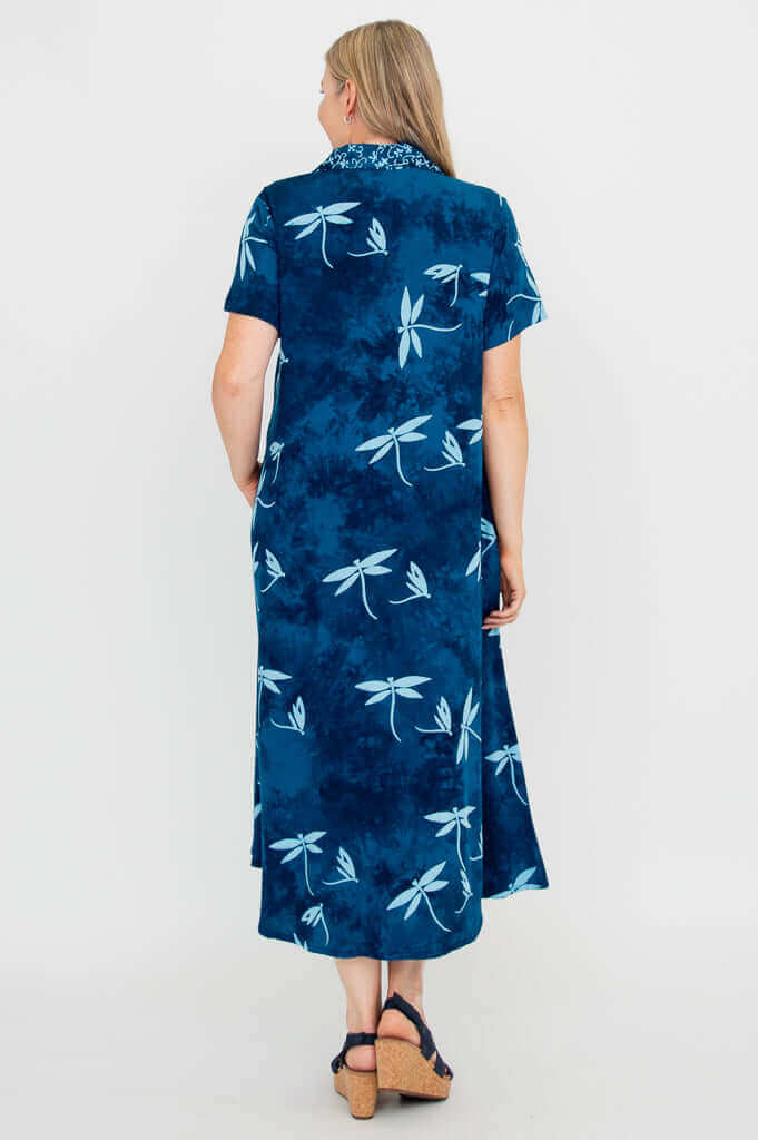Back view of a blue button-up short sleeve dress with dragonfly print