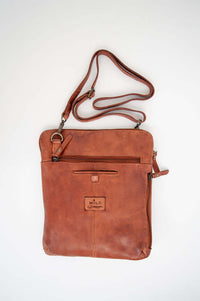 Rear view of the bag displaying additional zippered pocket and adjustable strap