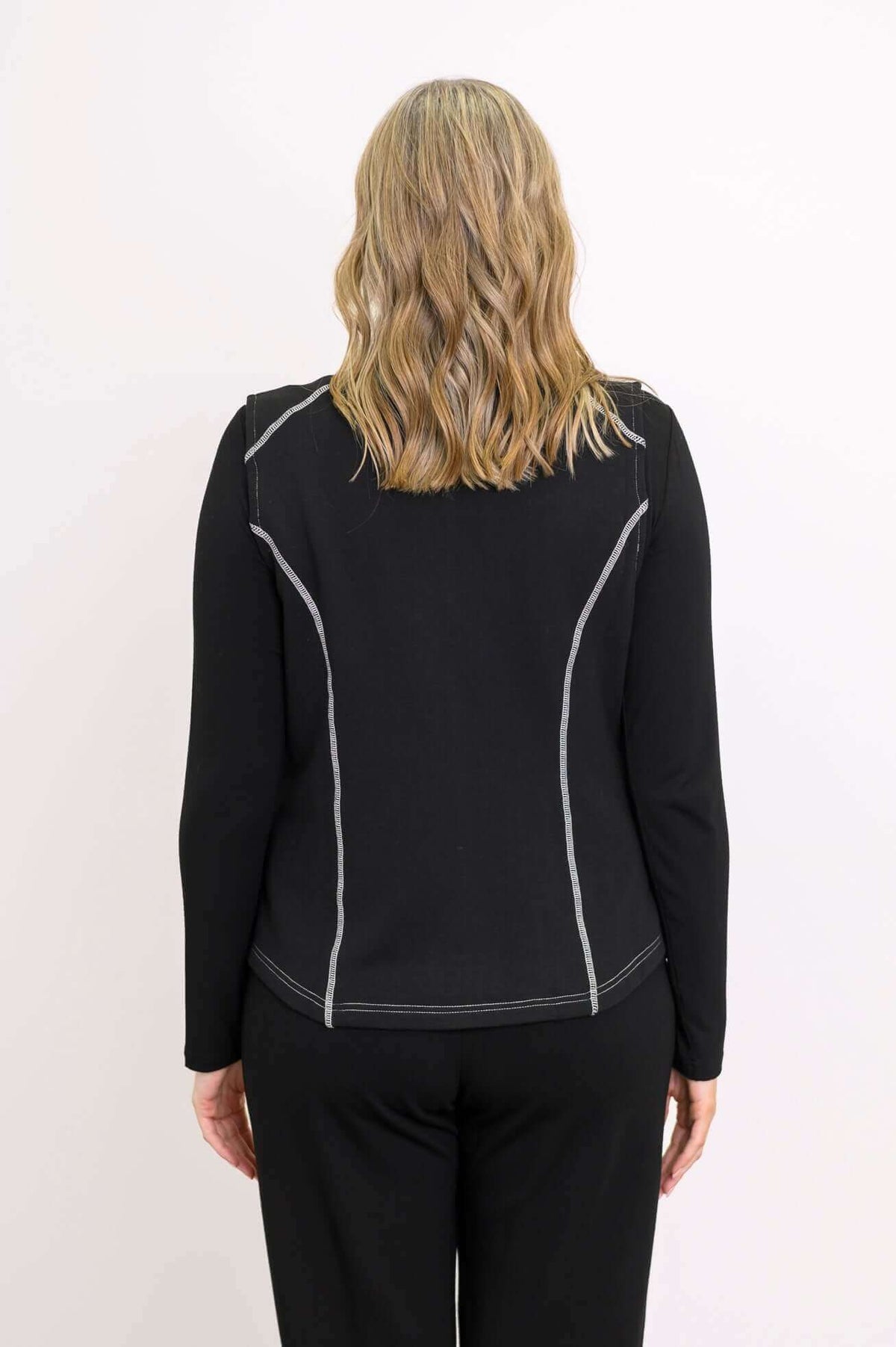 Back view of Hartford Utility Vest showing princess seams and contrast stitching