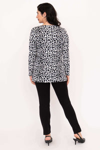 Back view of woman in Margie leopard print long sleeve top and black pants
