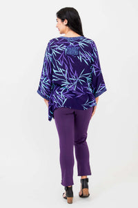 Back view of purple bamboo print tunic top showing patch detail and matching pants