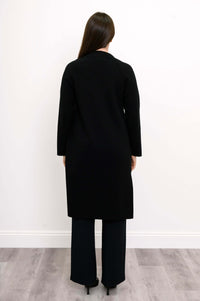 Back view of black open front cotton knit jacket on model