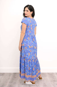Back view of blue floral boho maxi dress with peach trim and cap sleeves