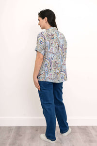 Back view of paisley print blouse showing the high-lo hem design