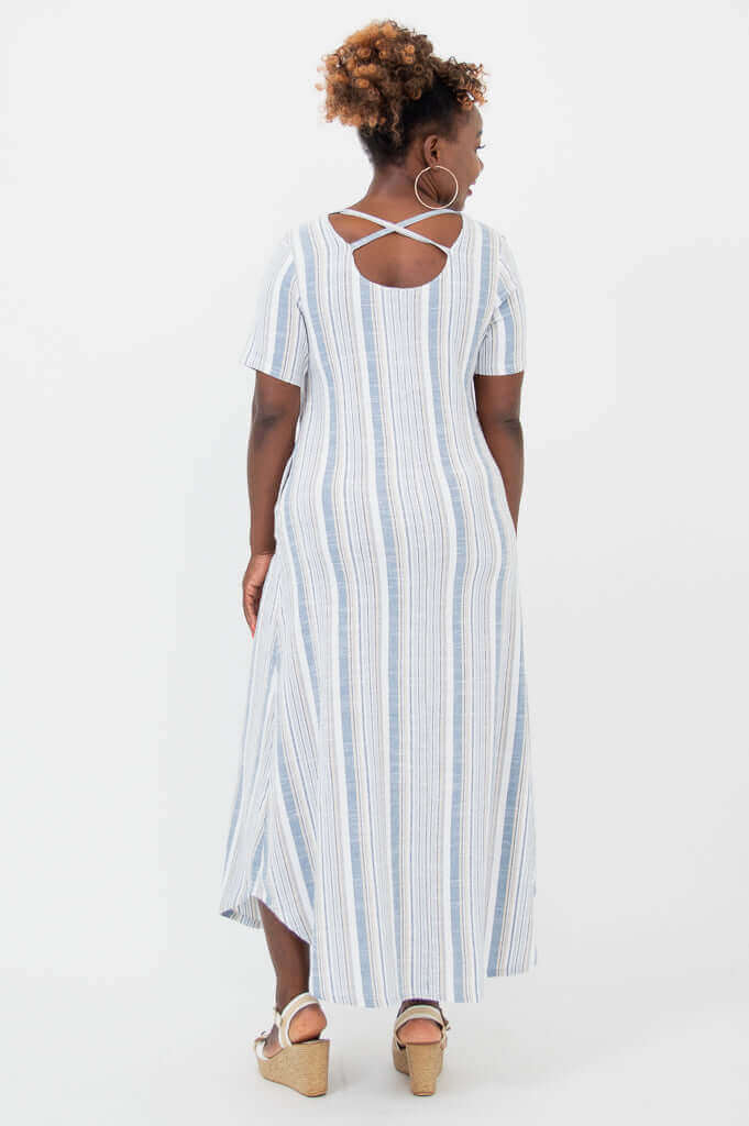 Back view of a striped maxi dress with crisscross strap detail