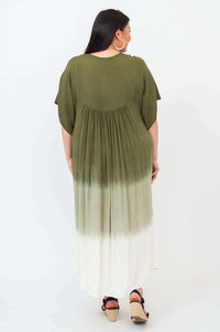 Back view of woman in olive ombre maxi dress showing pleated detail