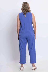 Back view of model in blue cropped pants with matching top
