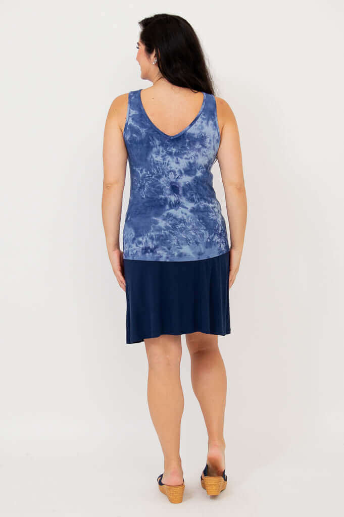 Back view of model wearing indigo tie dye reversible bamboo tank with V-neck