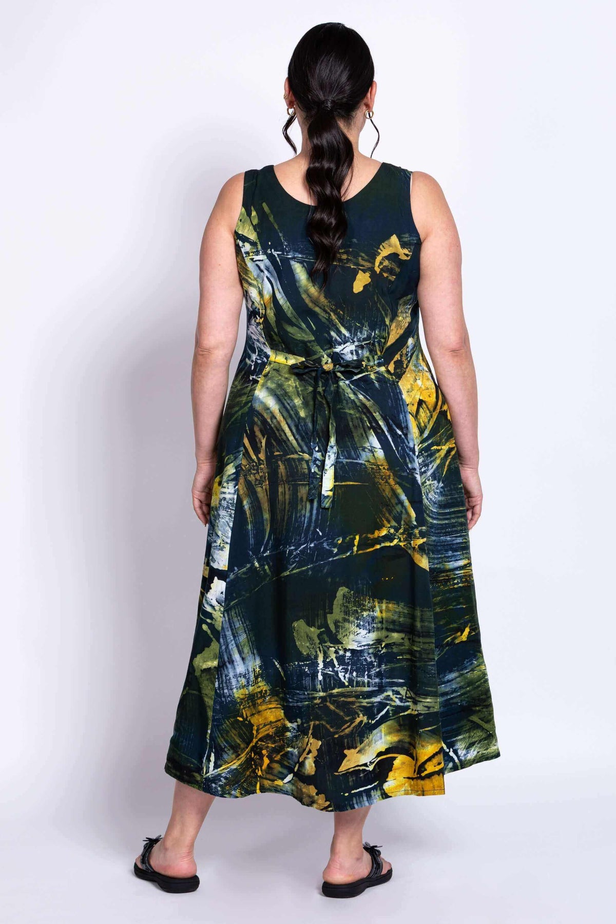 Back view of Sara summer dress revealing adjustable waist tie and abstract print detail