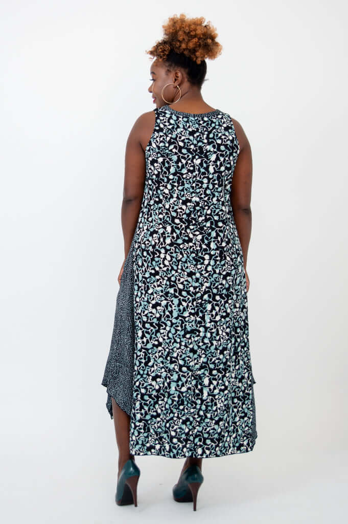 Back view of model wearing black and blue patterned tank dress