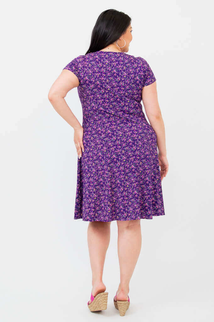 Back view of model wearing Callie Bamboo Dress in Violet Blossom print