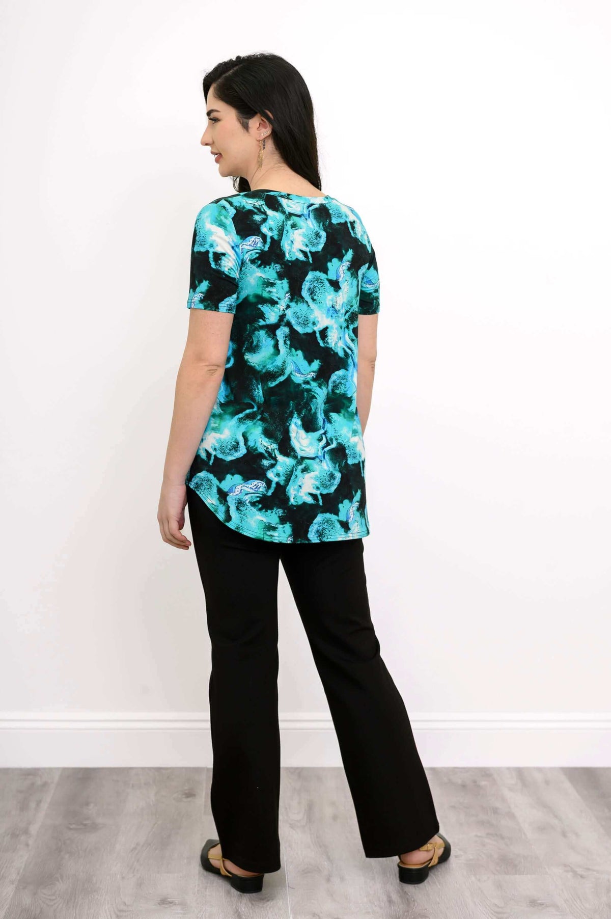 Back view of woman wearing Jackie bamboo V-neck top in Lagoon print