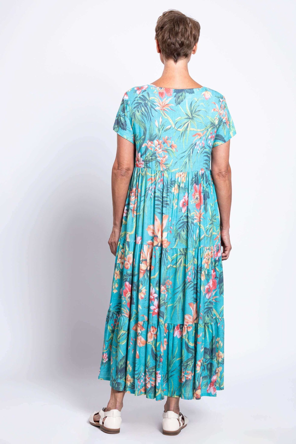 Back view of the Laurita blue floral maxi dress showing flounced tiers