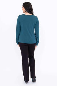 Back view of woman wearing teal Mona boat neck top with long sleeves