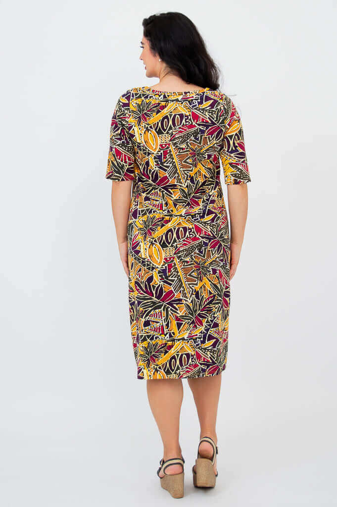 Back view of Olivia dress in Tropikal print, showing knee-length hem and sleeve details