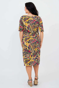 Back view of Olivia dress in Tropikal print, showing knee-length hem and sleeve details