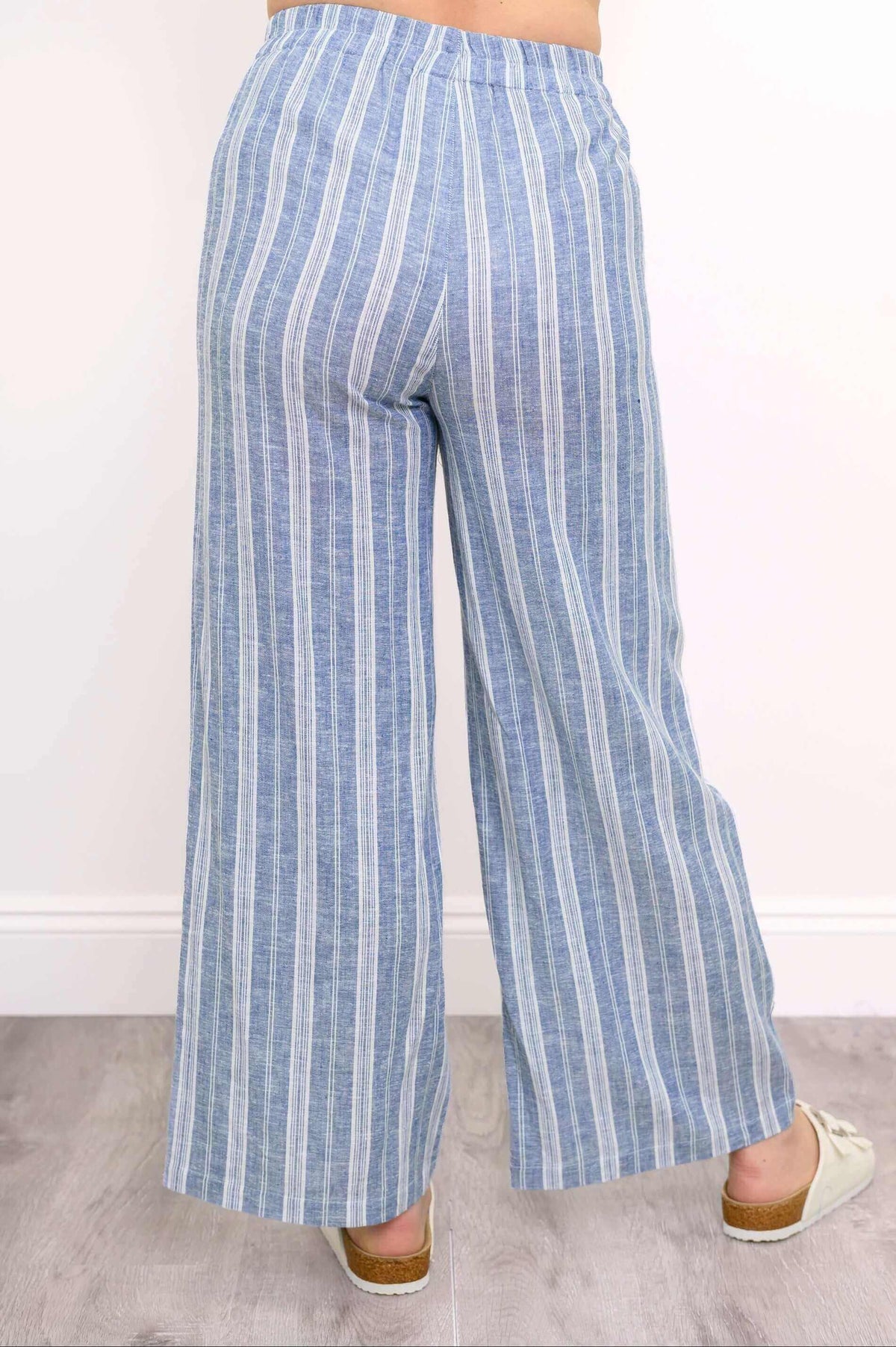 Back view of Parker Pant, blue and white vertical stripes, relaxed wide-leg design