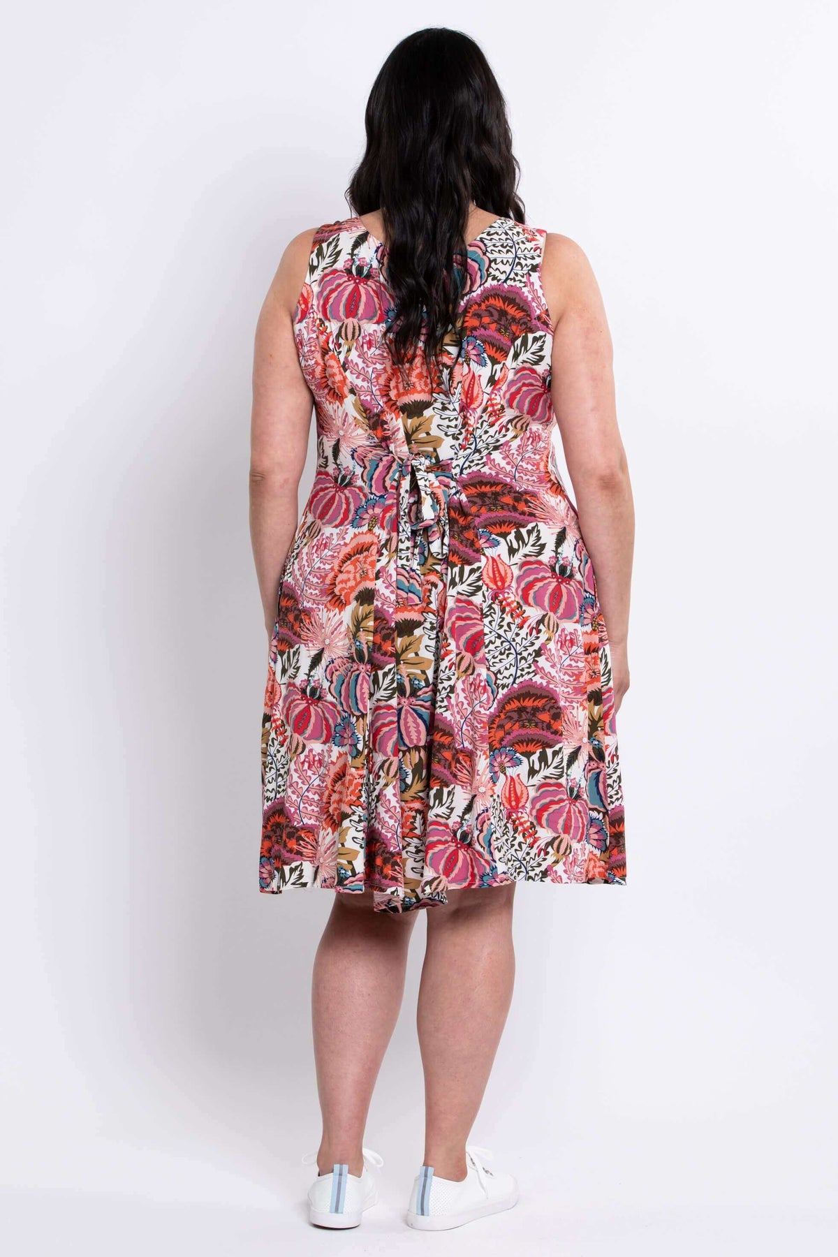 Back view of dress showing tie belt detail and vibrant floral print