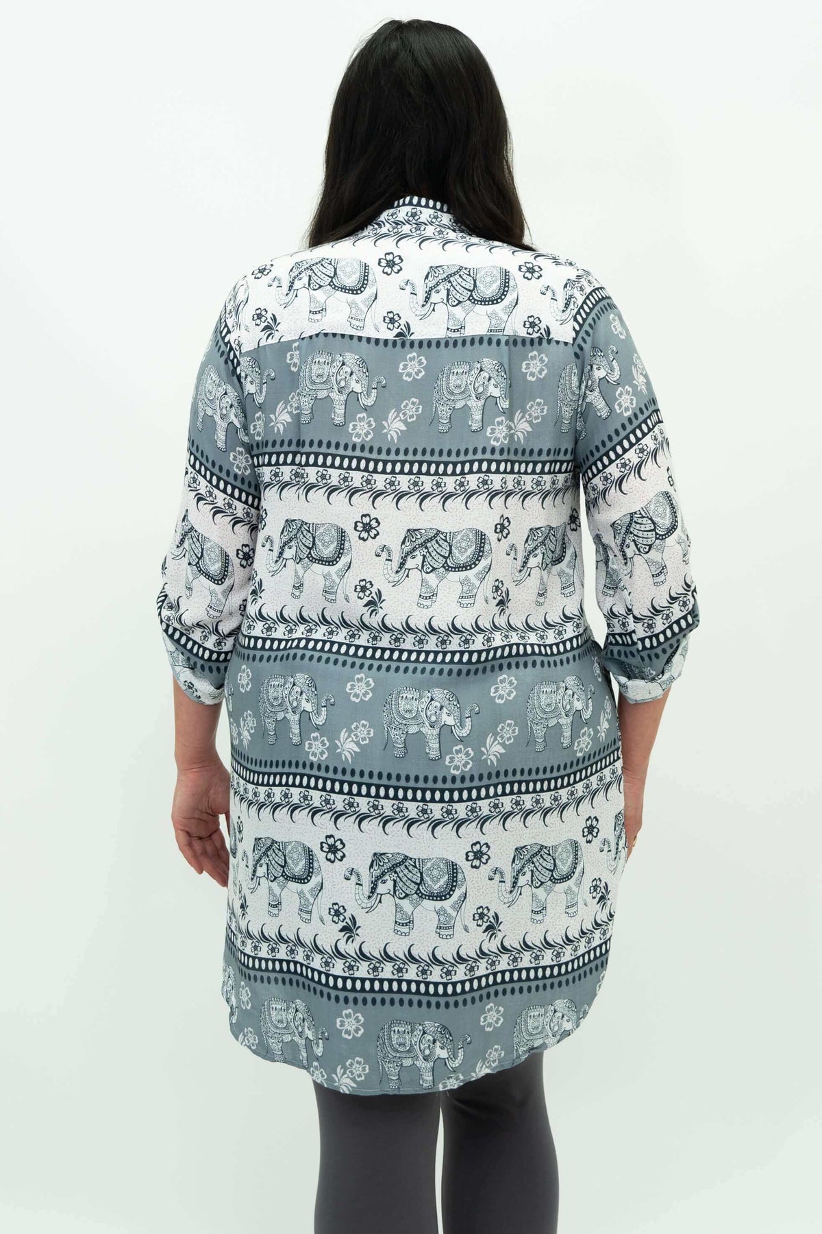 Back view of woman wearing elephant print tunic with curved hem
