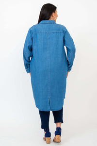 Back view of woman wearing a blue Anka denim duster with shirttail hem