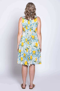 Back view of model in lemon tile print dress showing adjustable tie-back detail