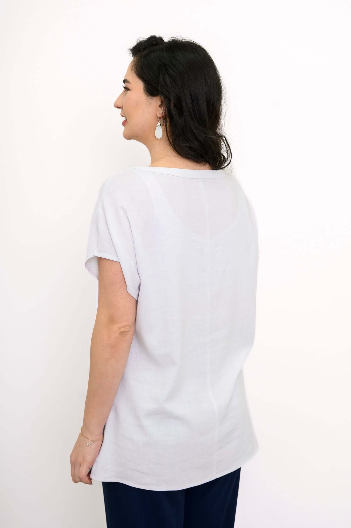 Back view of Aria Tee highlighting seam and relaxed fit