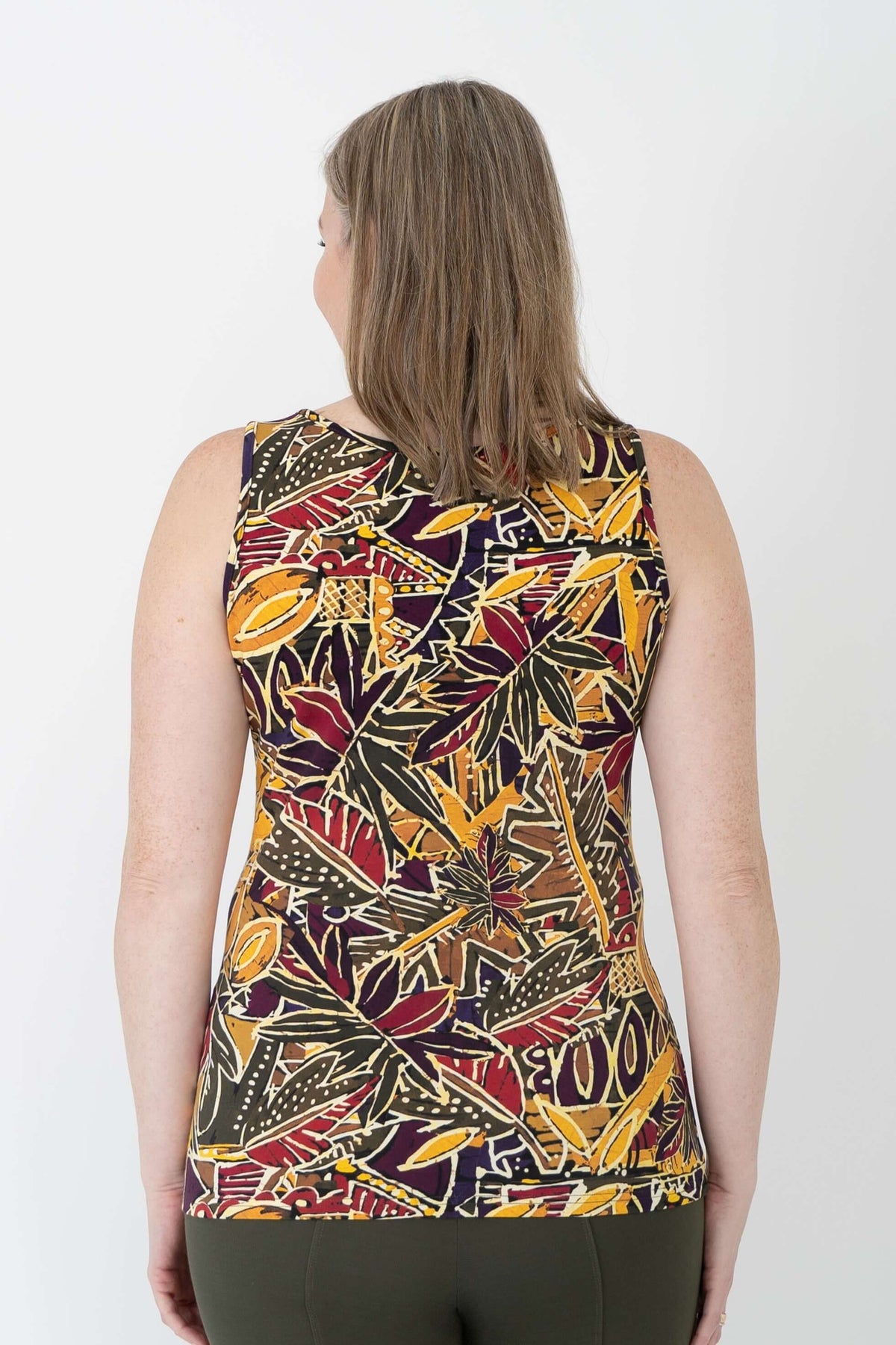 Back view of a woman wearing a marigold batik print bamboo cotton tank top