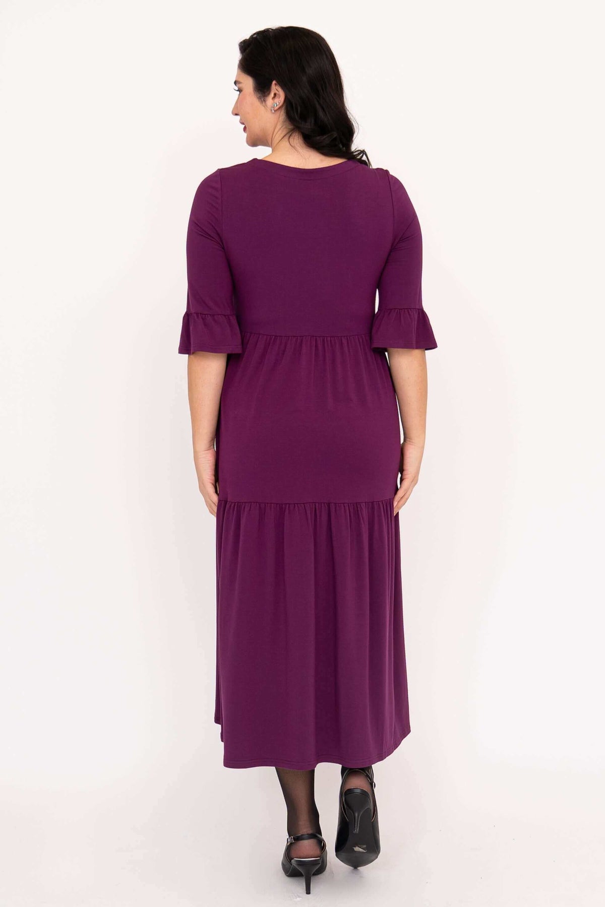 Rear view of the Bernadette Long Dress featuring ruffle sleeve detail in purple