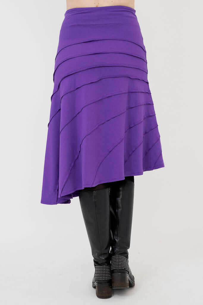Back view of Beverly Skirt in violet showing asymmetric hem