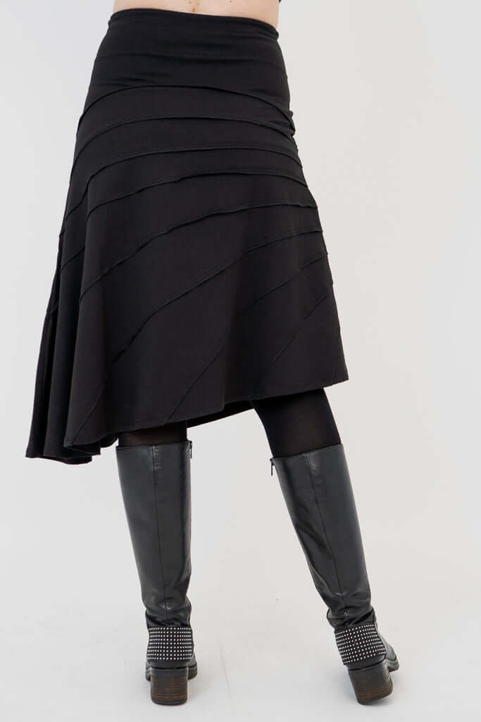 Back view of Beverly asymmetrical black skirt showing flowing lines and seam details