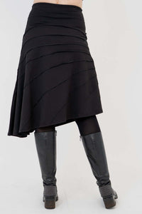 Back view of Beverly asymmetrical black skirt showing flowing lines and seam details