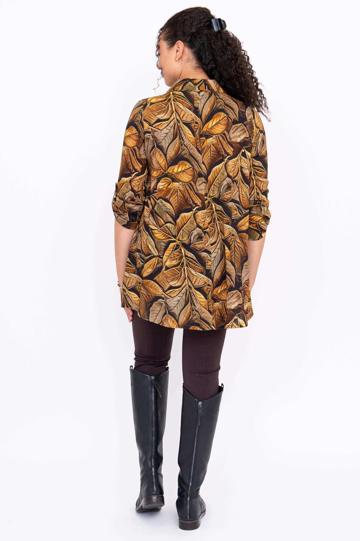 Rear view of a woman wearing the Celine Oversized Tunic in brown botanical print