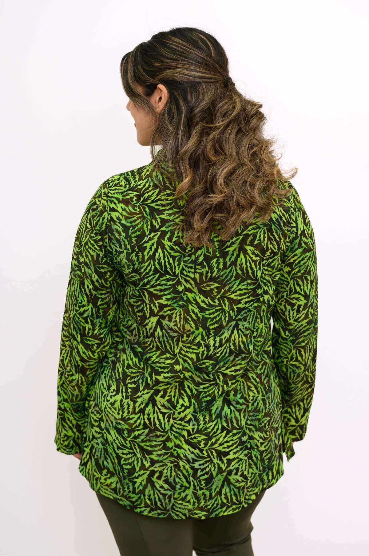 Back view of the Cindy green leaf print smocked top on a model