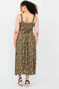 Back view of the Coraline floral maxi dress with shirred bodice and tie belt