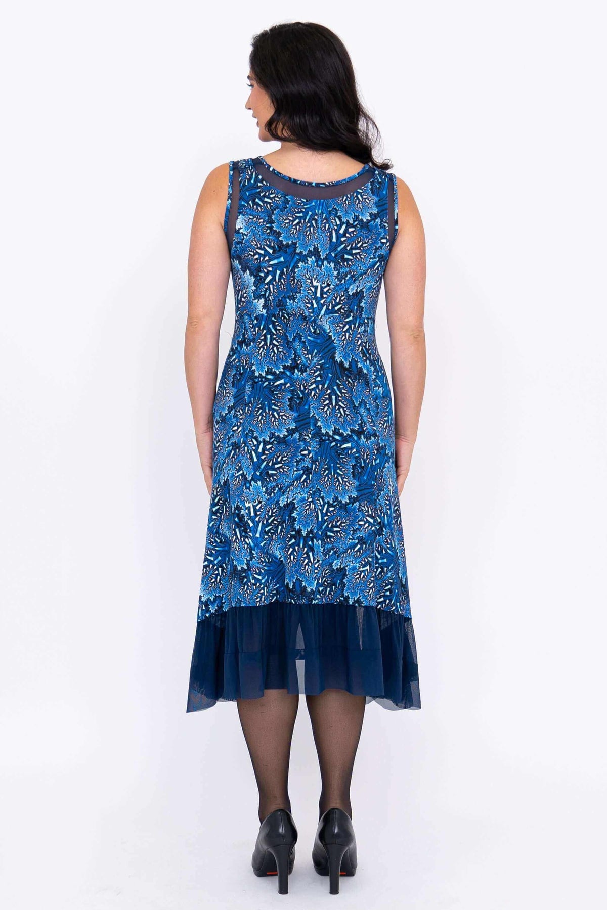 Back view of the blue floral Danube dress showing mesh hem and fitted waist