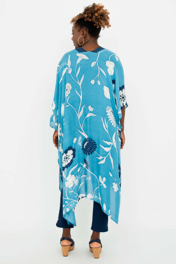 Back view of a woman wearing the Darcy Kimono Wrap showing the floral pattern