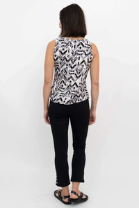 Back view of woman showing sleeveless black and white geometric print tank top