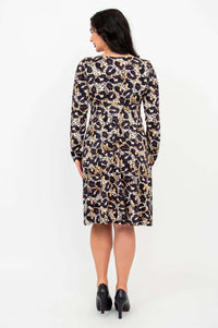 Back view of a woman wearing a long-sleeve leopard print dress