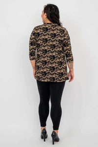 Back view of woman in Edwina bamboo top with gold filigree design