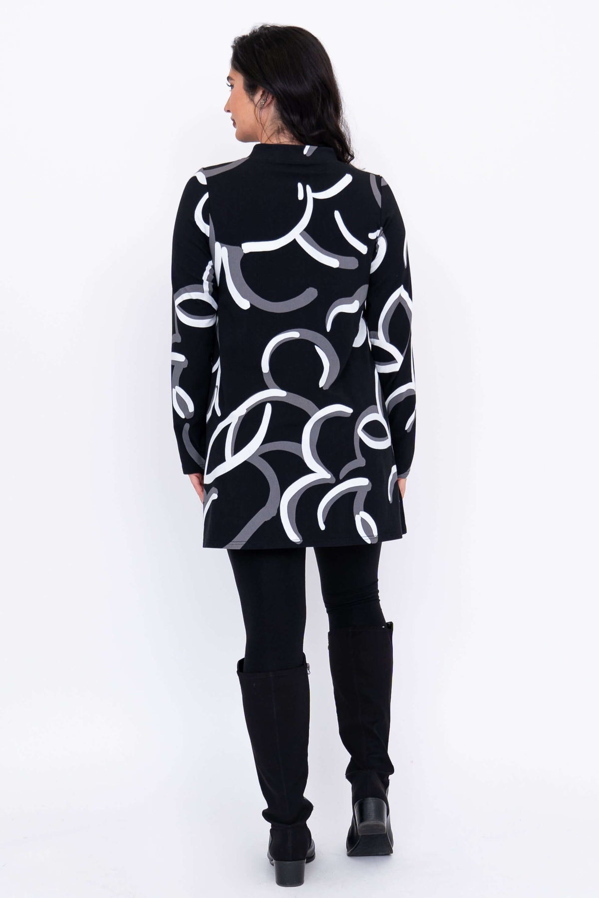Back view of  tunic showing all-over abstract pattern in white and grey.