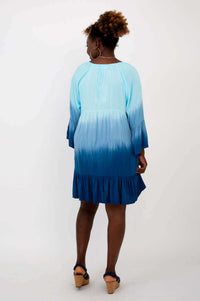 Back view of model in Ellie Dress, showing ombre color gradient and sleeve details