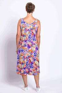 Rear view of woman wearing a vibrant floral tank dress