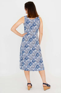 Woman showing the back of a sleeveless blue and white patterned tank dress